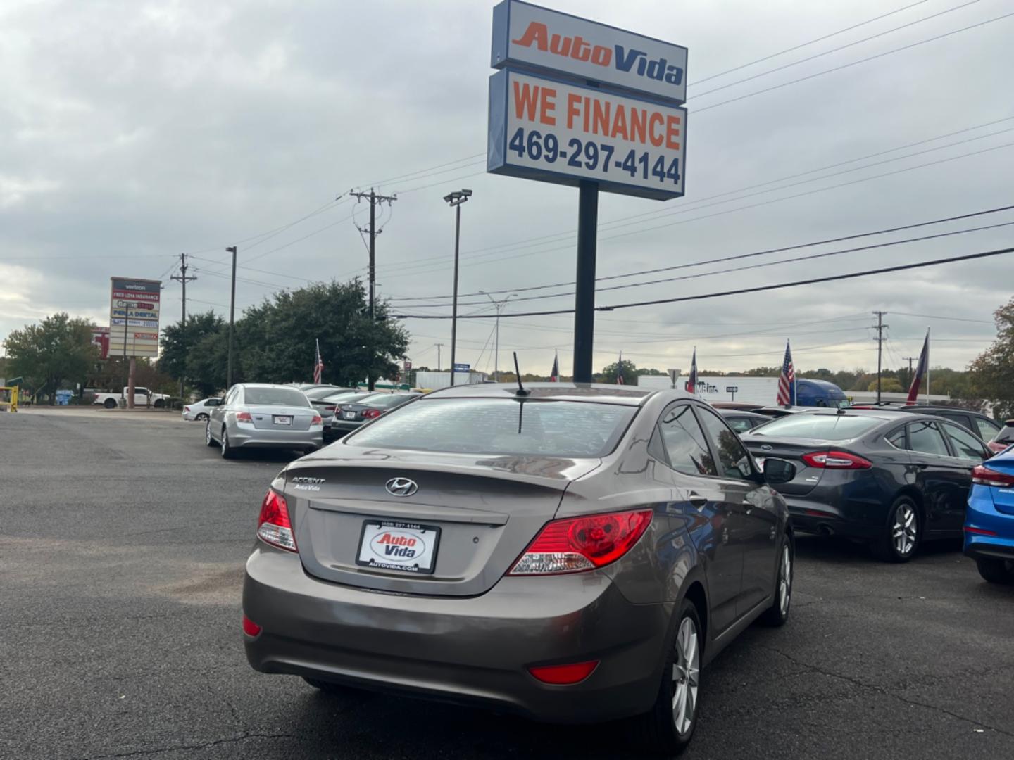 2013 BROWN HYUNDAI ACCENT GLS GLS 4-Door (KMHCU4AE3DU) with an 1.6L L4 DOHC 16V engine, located at 420 I-35E, Lancaster, TX, 75146, (469) 297-4144, 32.593929, -96.823685 - Photo#6